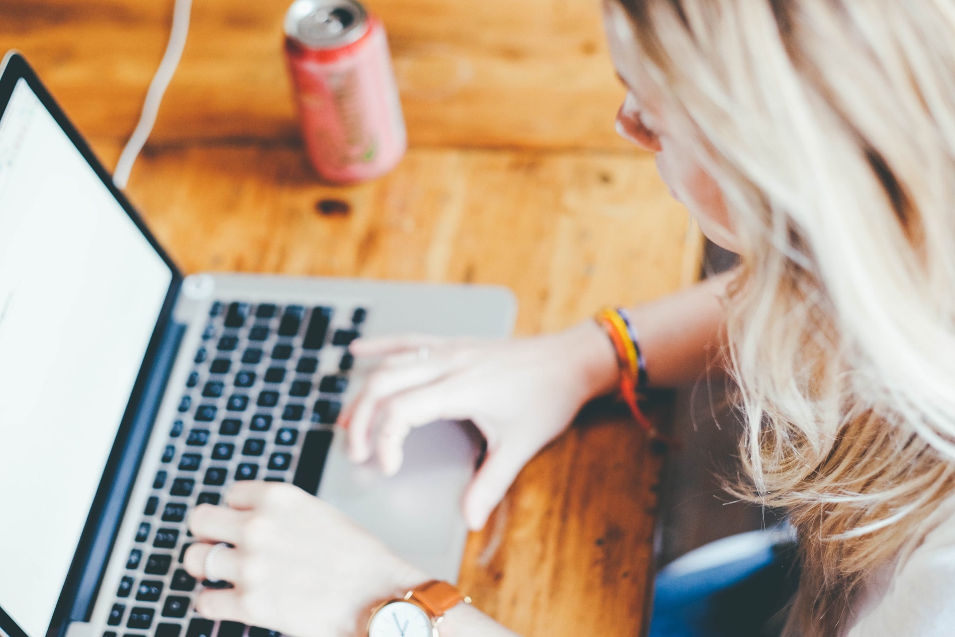 A woman working on a MacBook